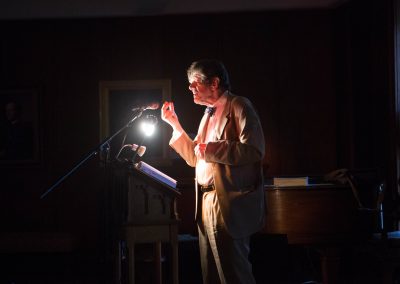 Michael O'Siadhail reads poetry in dark room